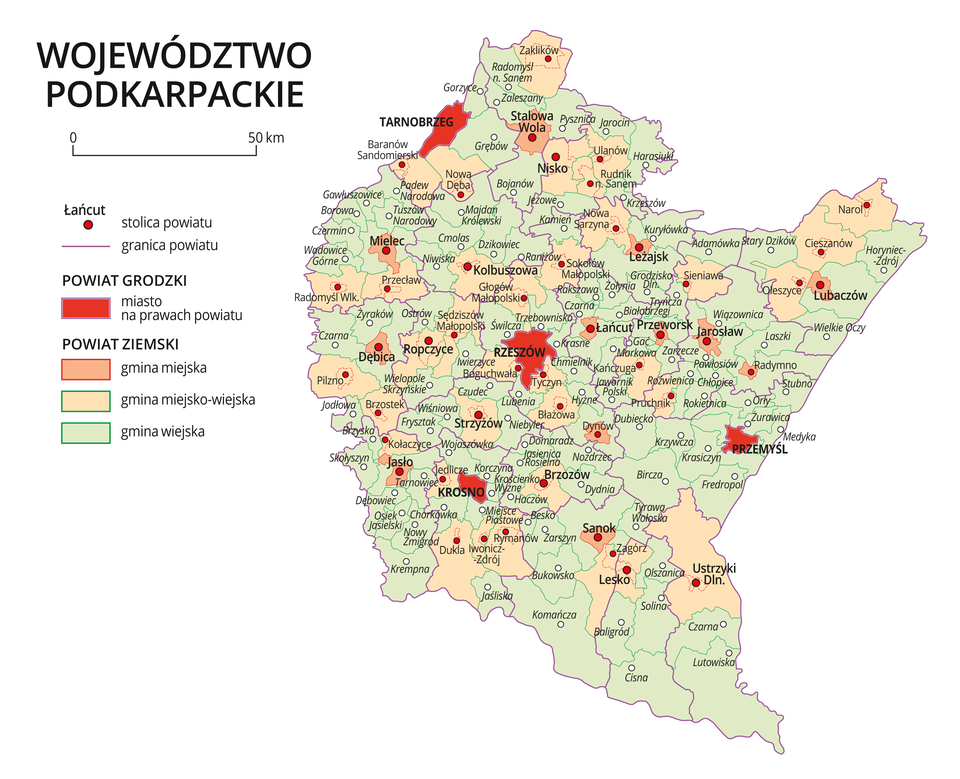 Mapa województwa podkarpackiego. Na mapie fioletowymi liniami zaznaczono granice powiatów ziemskich, dużymi czerwonymi kropkami zaznaczono miasta będące stolicami powiatów. W obrębie powiatów ziemskich kolorami wyróżniono gminy miejskie, miejsko-wiejskie i wiejskie. Czerwonym kolorem wyróżniono powiaty grodzkie z miastami na prawach powiatu, miasta te opisano dużymi literami. Kolory i znaki użyte na mapie opisano w legendzie. W legendzie podziałka liniowa.