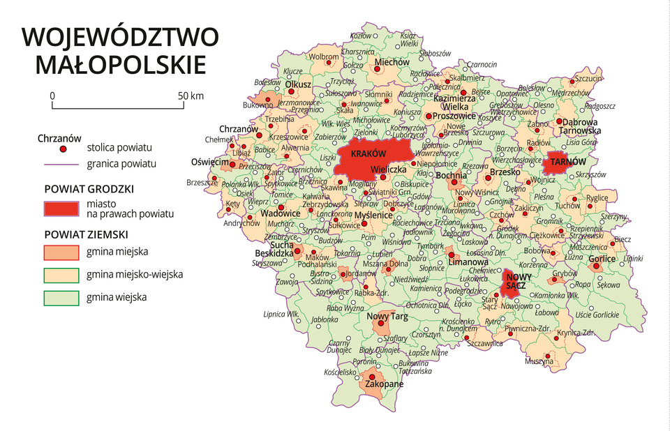 Mapa województwa małopolskiego. Na mapie fioletowymi liniami zaznaczono granice powiatów ziemskich, dużymi czerwonymi kropkami zaznaczono miasta będące stolicami powiatów. W obrębie powiatów ziemskich kolorami wyróżniono gminy miejskie, miejsko-wiejskie i wiejskie. Czerwonym kolorem wyróżniono powiaty grodzkie z miastami na prawach powiatu, miasta te opisano dużymi literami. Kolory i znaki użyte na mapie opisano w legendzie. W legendzie podziałka liniowa.