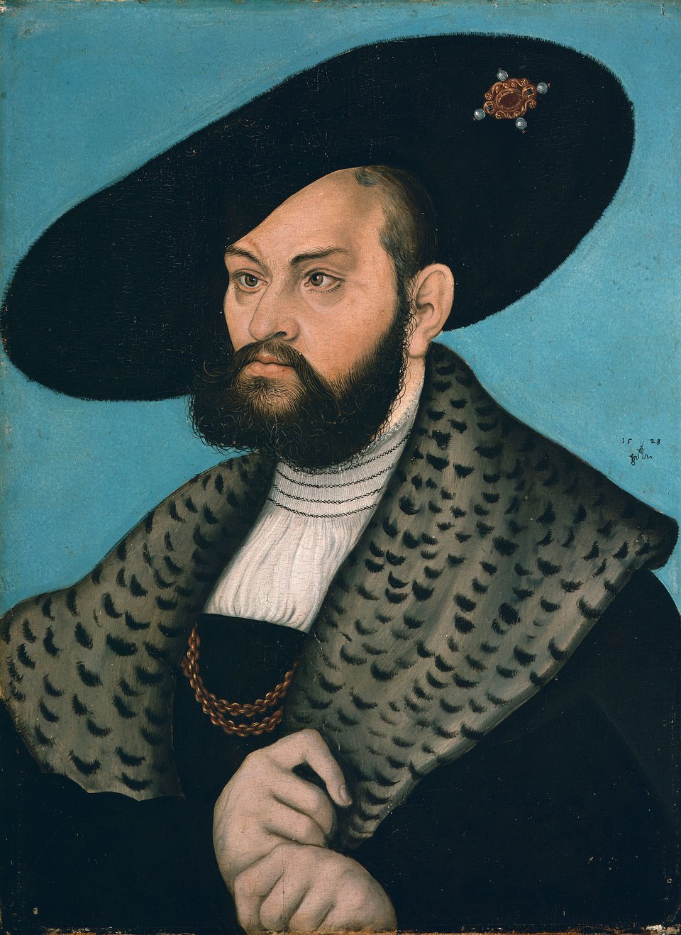 Portret margrabiego Alberta Brandenburg-Ansbach, księcia Prus Widoczna charakterystyczna wada wzroku księcia (zez). Źródło: Lucas Cranach Starszy, Portret margrabiego Alberta Brandenburg-Ansbach, księcia Prus, 1528, olej na buku, Herzog Anton Ulrich-Museum, domena publiczna.