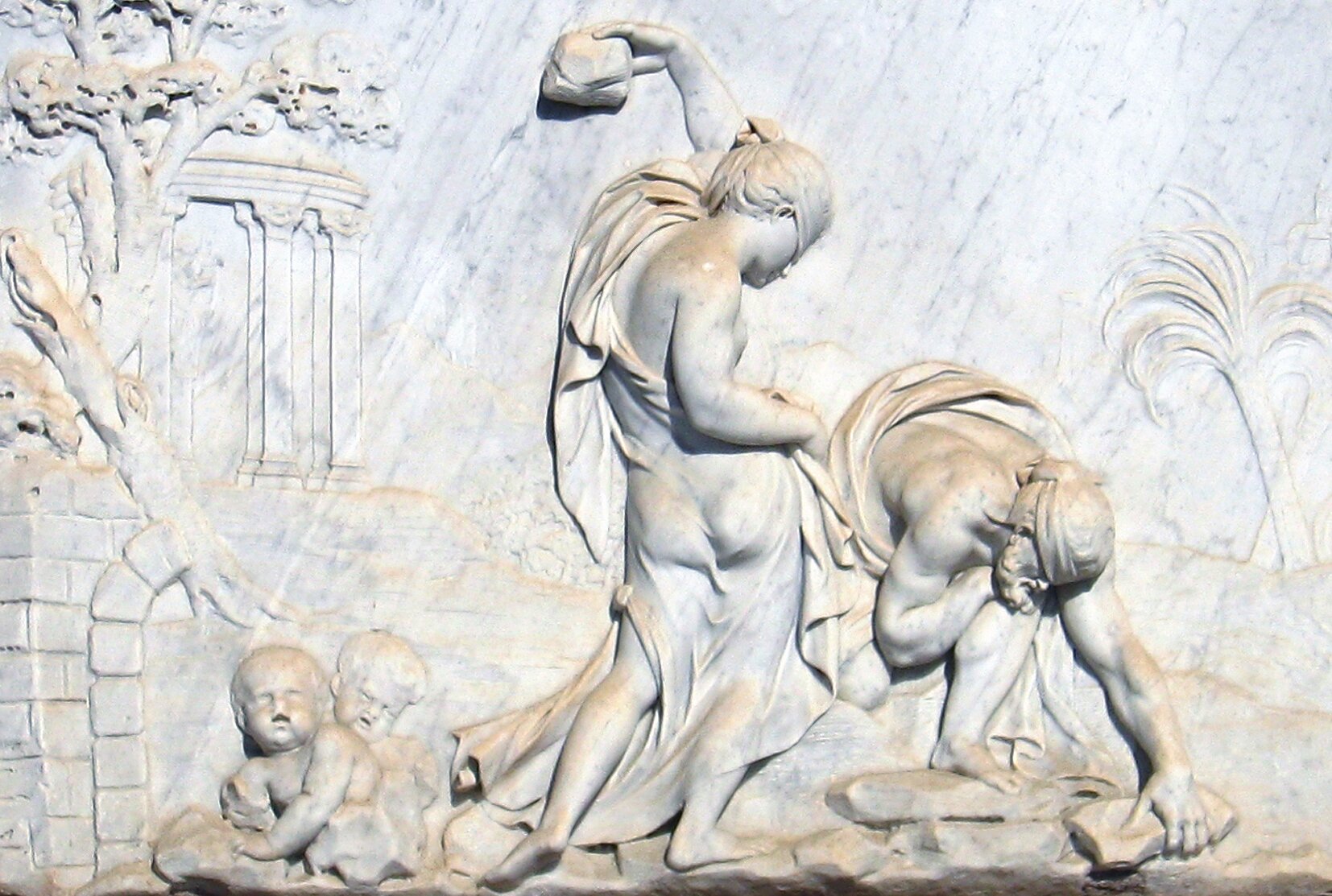 Relief przedstawiający Deukaliona i Pyrrę w Parc del Laberint w hiszpańskiej Barcelonie. Relief przedstawiający Deukaliona i Pyrrę w Parc del Laberint w hiszpańskiej Barcelonie. Źródło: licencja: CC BY 3.0.