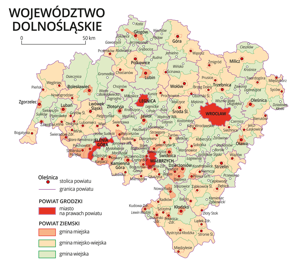 Mapa województwa dolnośląskiego. Na mapie fioletowymi liniami zaznaczono granice powiatów ziemskich, dużymi czerwonymi kropkami zaznaczono miasta będące stolicami powiatów. W obrębie powiatów ziemskich kolorami wyróżniono gminy miejskie, miejsko-wiejskie i wiejskie. Czerwonym kolorem wyróżniono powiaty grodzkie z miastami na prawach powiatu, miasta te opisano dużymi literami. Kolory i znaki użyte na mapie opisano w legendzie. W legendzie podziałka liniowa.