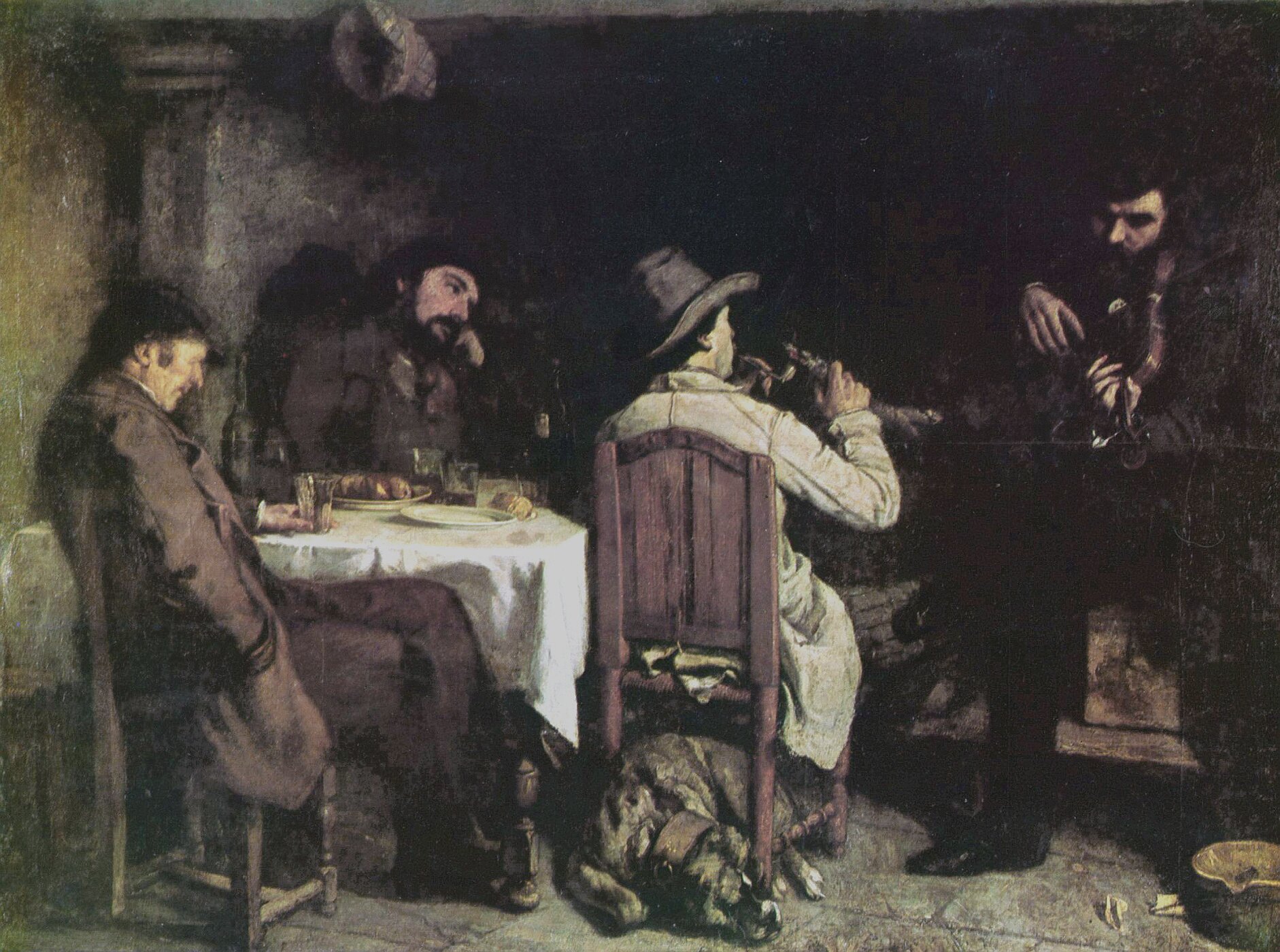 Obraz przedstawia czterech mężczyzn. Trzech siedzi przy stole, czwarty siedzi nieco obok i gra na jakimś instrumencie. Pod krzesłem jednego z mężczyzn leży pies. Wszyscy ubrani są w proste stroje. Wnętrze pomieszczenia, w którym siedzą, tonie w półmroku..