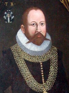 Ilustracja przedstawia podobiznę Tycho Brahe. Mężczyzna w wieku ok. 40-50 lat. Włosy, broda i długie wąsy koloru brunatno-brązowego. Czoło wysokie, gładkie. Nos prosty. Oczy ciemne, szeroko otwarte. Pod szyją biały kołnierz (kreza). Mężczyzna ubrany w czarne obranie, pod kołnierzem i na torsie założony szeroki, złoty łańcuch.